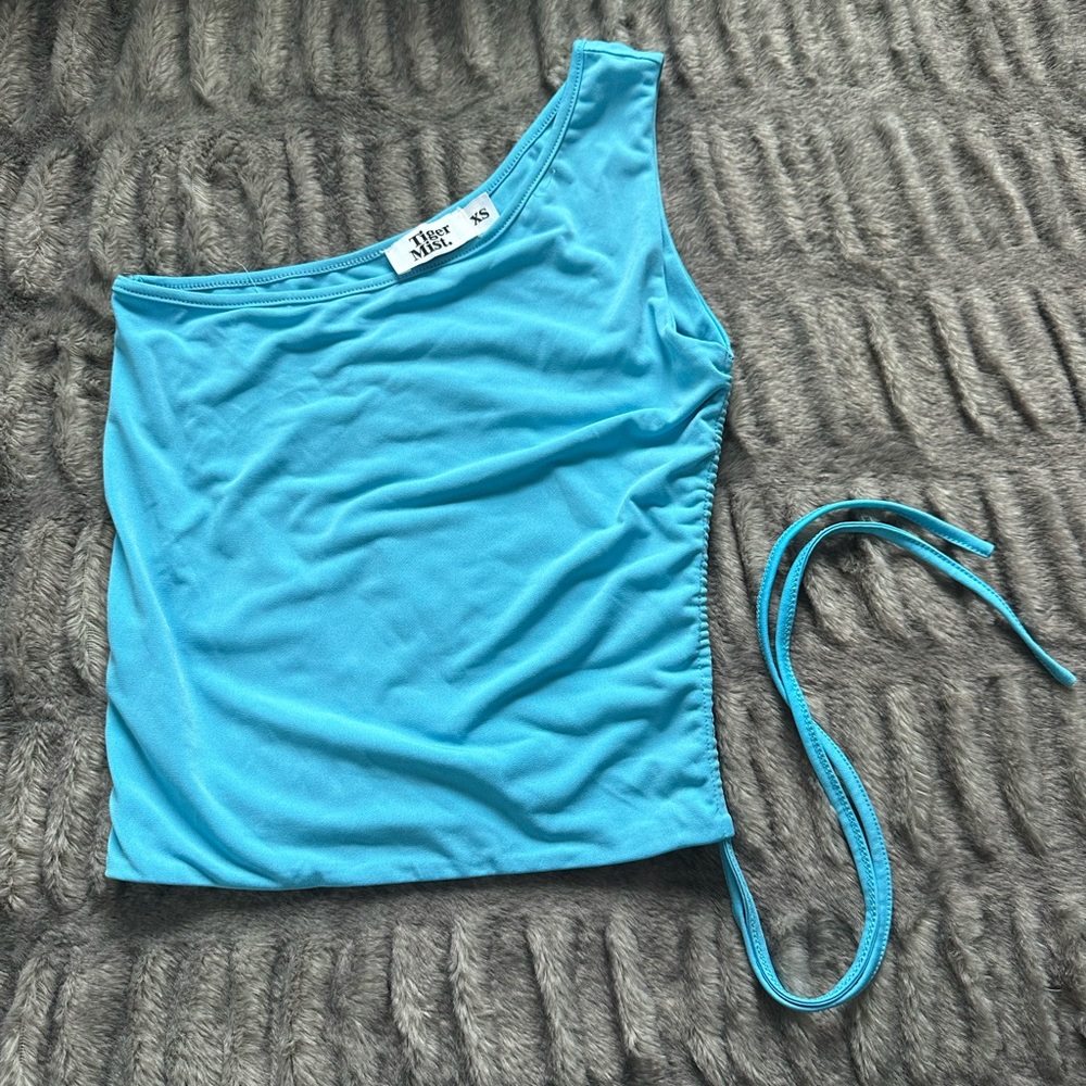 Tiger Mist asymmetrical blue top!I’ve never worn this I purchased the wrong size